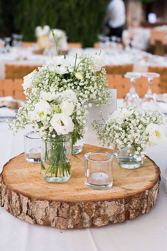 Rustic Wedding Centerpiece with wood slice and bud vases with babies breath